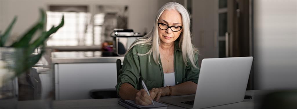 Two older adult couples , looking happy with a palm tree in the background