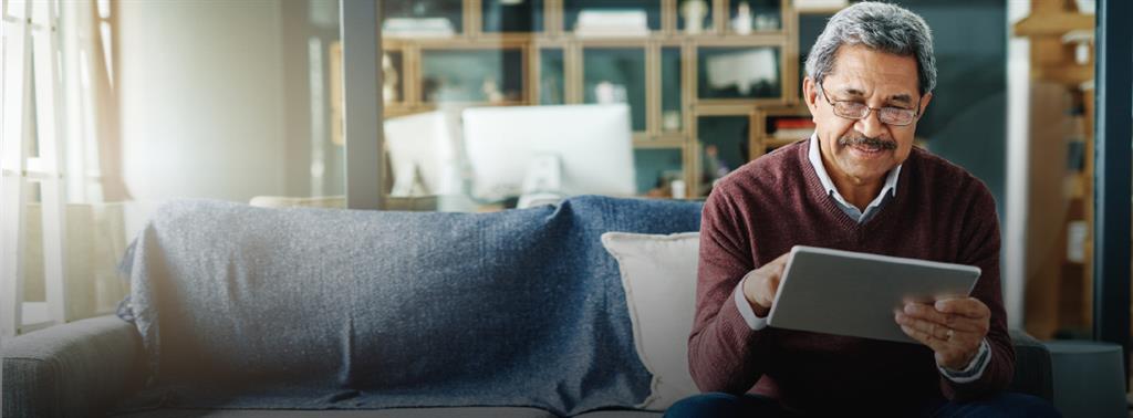 Two older adult couples , looking happy with a palm tree in the background