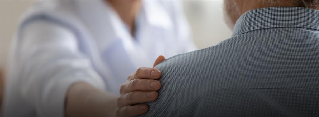 Two older adult couples , looking happy with a palm tree in the background