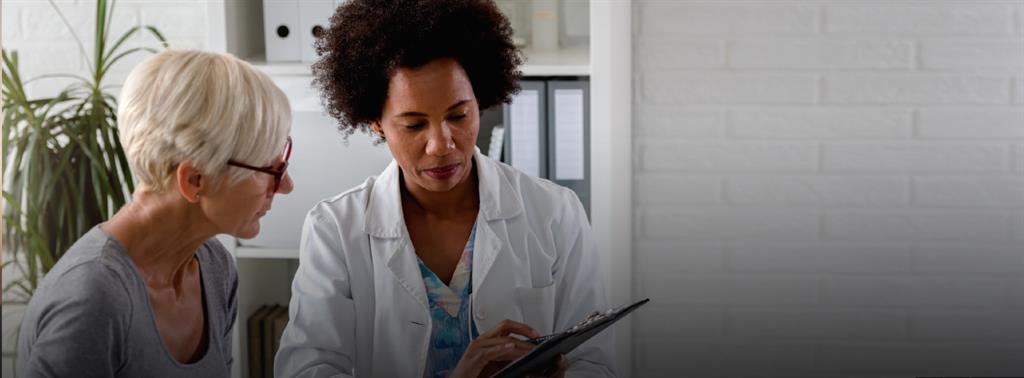 Two older adult couples , looking happy with a palm tree in the background