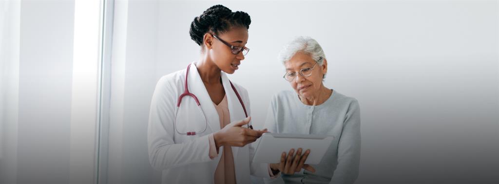 Two older adult couples , looking happy with a palm tree in the background